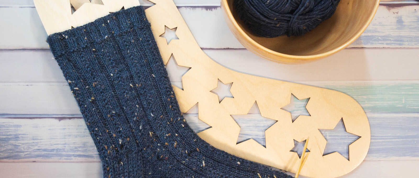 Knitted tweed socks on star sock blockers