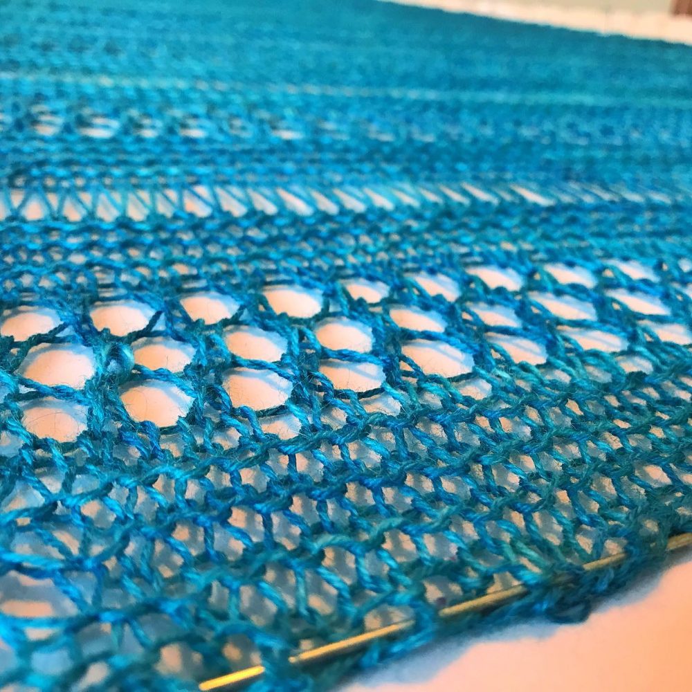 knitted shawl blocked with wires