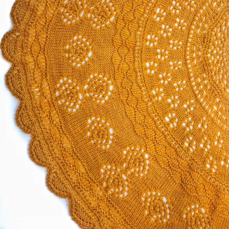 Golden mustard knit lace with intricate circular patterns, delicate eyelets, and a scalloped edge